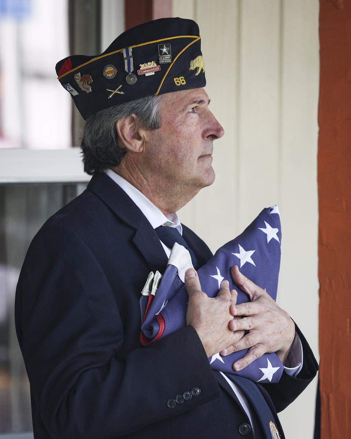 U.S. veteran Robert Bettencourt holds the flag as the ceremony comes to a close. About 200 people attended the Memorial Day observance held on May 25, 2026, at the America Legion Post 66 in San Luis Obispo.
