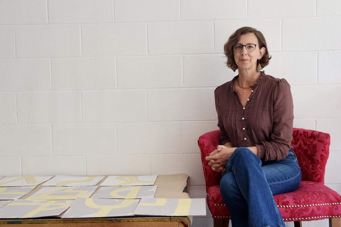 Artist Allie Mount, co-owner of Fieldwork in Atascadero, poses next to her latest project, interactive tile designs for the studio’s bathroom. Fieldwork moved to its downtown location at 5880 Entrada Avenue in March 2026.