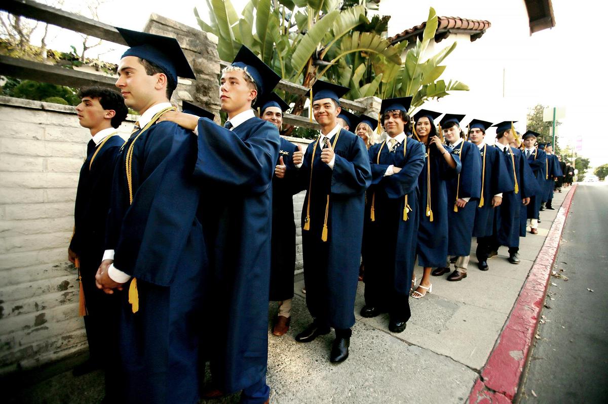 About to be graduates line up outside the San Luis Obispo Mission church. Eighty-three Mission Prep students graduated in San Luis Obispo, California, earning nearly $2 million in scholarships.