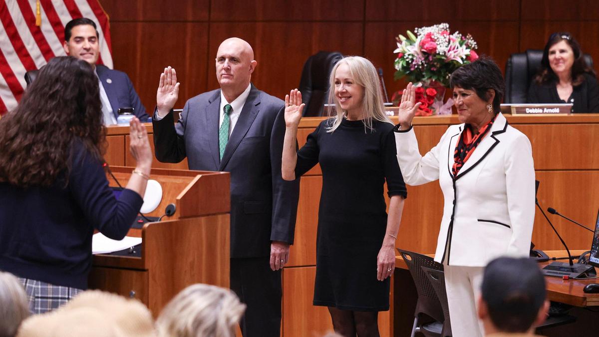 Heather Moreno, center, was sworn in as incoming San Luis Obispo County’s incoming District 5 supervisor along with returning incumbents John Peschong and Dawn Ortiz-Legg on Jan. 7, 2025. Clerk-Recorder Elaina Cano administers the oath, while Supervisor Jimmy Paulding and outgoing Supervisor Debbie Arnold look on.