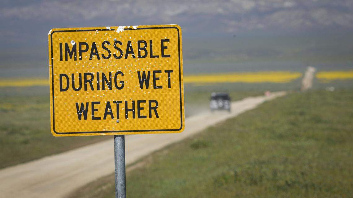 This season's heavy rains continues to make low spots on some roads, like Panorama, deep gumbo mud and the closed signs warn motorists not to enter. Wildflower season is in full bloom on the Carrizo Plain seen here on March 11, 2026.