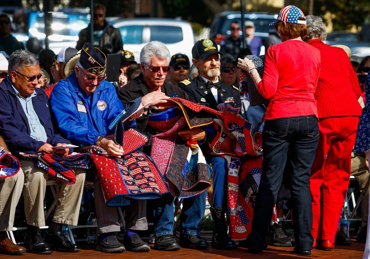 Quilts of Valor are presented to veterans during the Veterans Day ceremony at the Faces of Freedom Veterans Memorial in Atascadero in 2018.