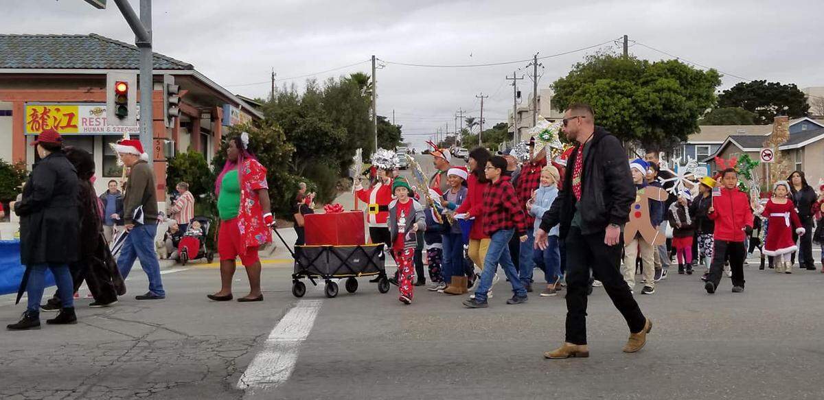 Kids with Grover Beach Elementary School walked in the annual parade wearing festive garb, including Santa hats, elf ears and even some dressed as snowflakes.