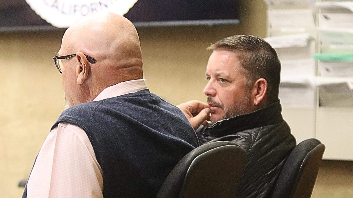 Giovanni DeGarimore, owner of Giovanni’s Fish Market in Morro Bay, sits with defense attorney Ilan Funke-Bilu in court on April 2, 2026. DeGarimore will face trial for multiple felony charges including the possession of child pornography and illegal guns.