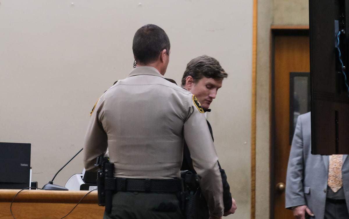Cole Corrigan is taken into custody on Dec. 19, 2023 after pleading guilty to two privacy charges and one felony gun charge.