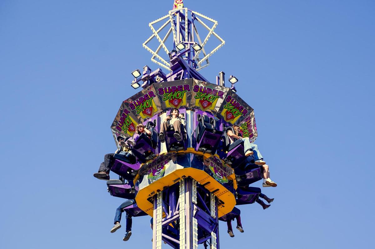 Tribune reporter Angel Corzo rides the Super Shot at the California Mid-State Fair on Wednesday, July 16, 2025. The Mid-State Fair will run from July 16-27.