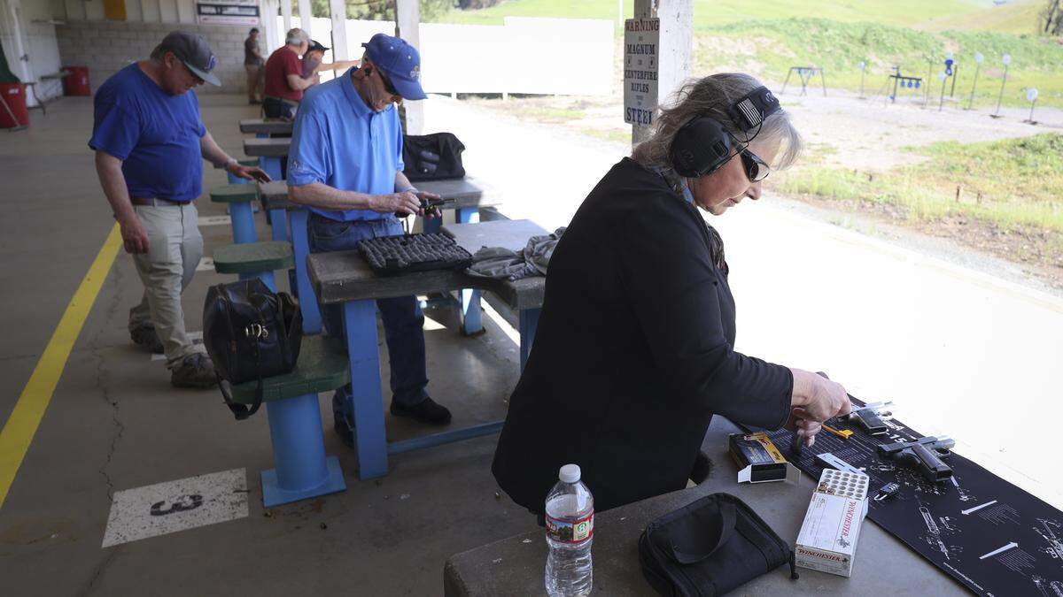 Terri Stuart prepares to shoot a handgun. After being closed to the public for 14 months the San Luis Obispo Shooting Range is open again on Highway 1, seen here on Feb. 27, 2026.