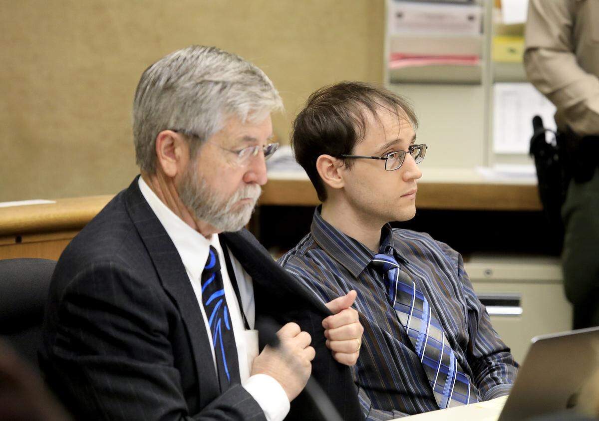 The trial for Levente Lazar, 26, of Bloomington, Indiana, who is accused of murdering his mother, Athena Ilona Valentiny, in 2018, began Wednesday. Lazar is seated next to defense attorney Jay Petersen. 