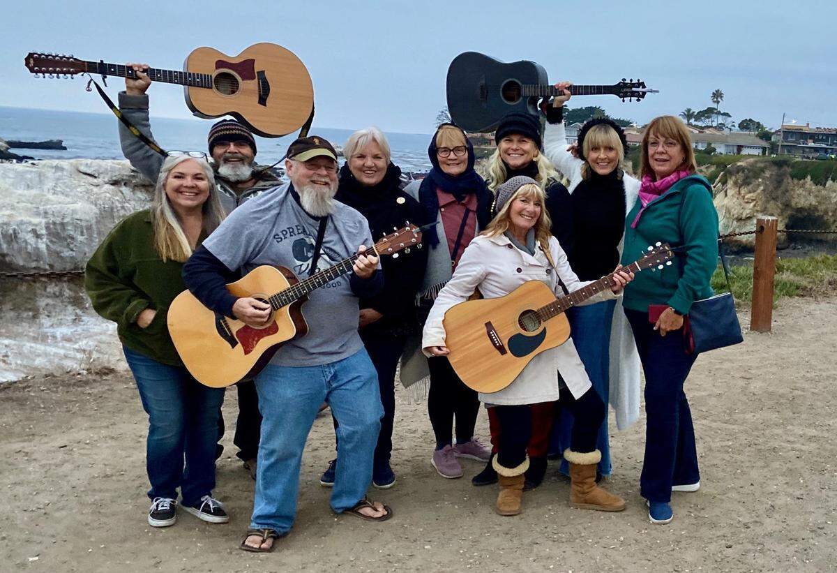 Denise Smart, far right, with the Jam Fam at the bench in Margo Dodd Park.