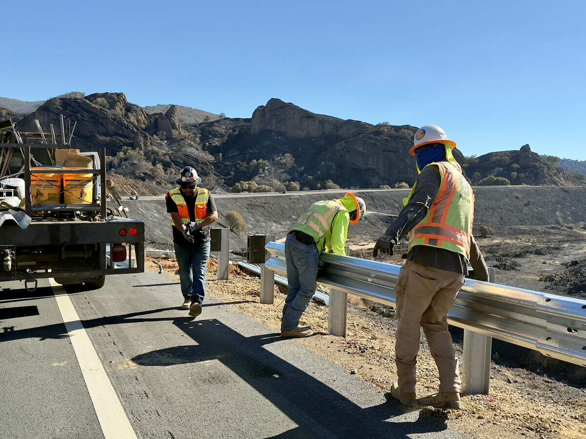 California Department of Transportation construction crews work on repairing guard rails along Highway 166 after the Gifford Fire damaged stretches of the roadway.