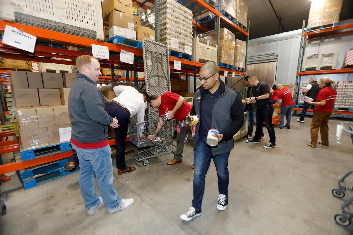 Bank of America employees volunteer to package donated food in SLO Food Bank’s 20,000-foot San Luis Obispo warehouse.