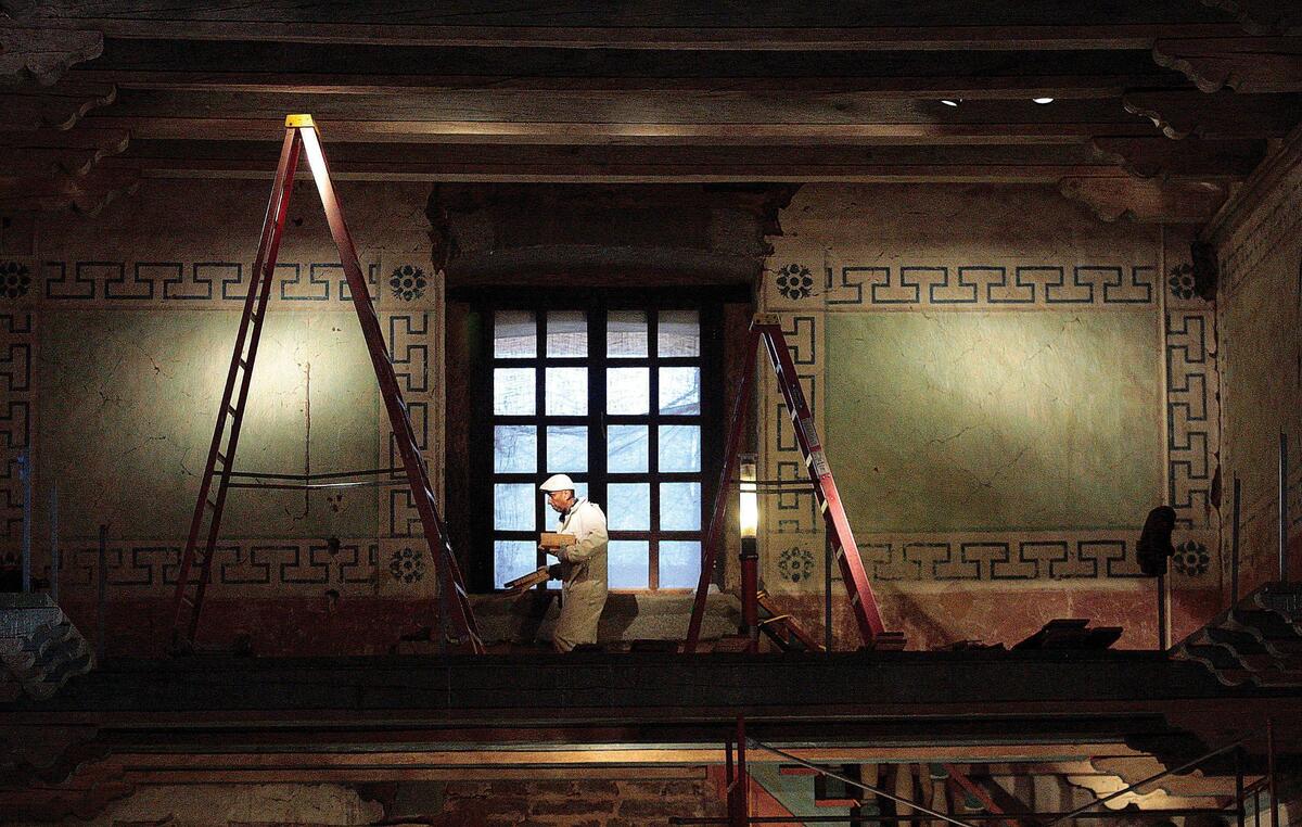 Mission San Miguel was slated to open in September 2009 after an almost six-year closure in the wake of the damage caused by the San Simeon Earthquake. Larry Limon foreman of the plaster crew works in the choir loft, before the restoration this wall was covered with cracks.