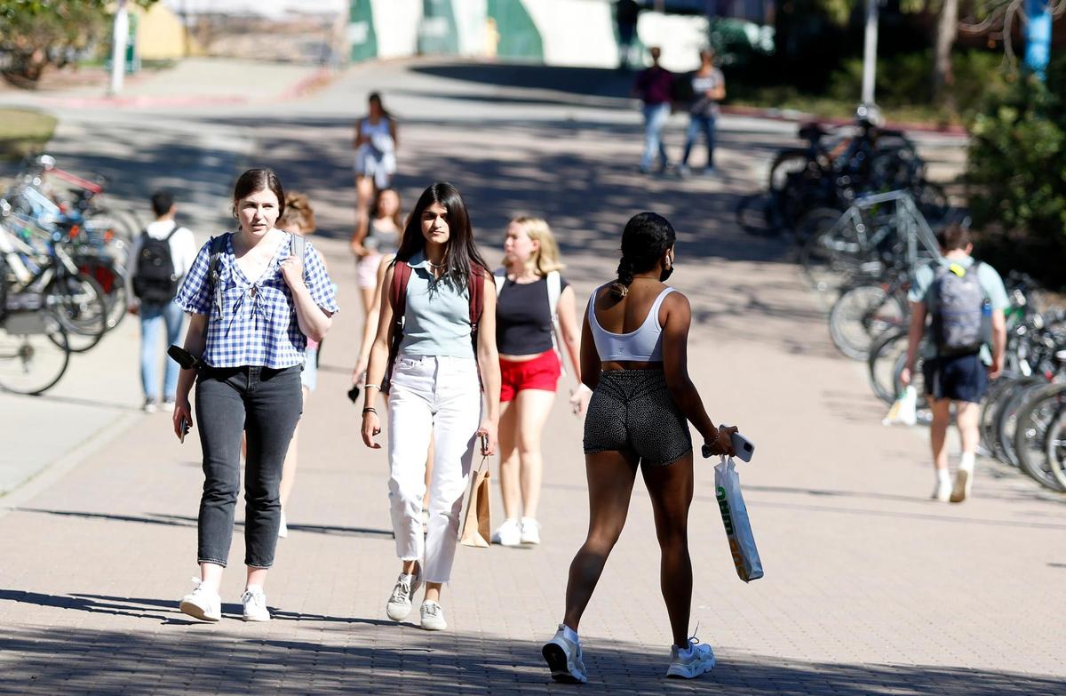 Cal Poly students walk to and from classes on a February afternoon. The school is the whitest public university in California.