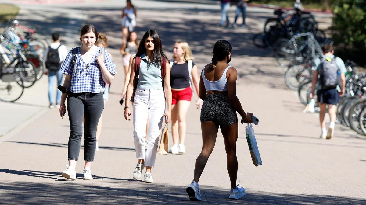 Students at Cal Poly in San Luis Obispo walk to and from classes in February 2022. The campus is not one of those suffering enrollment shortages.