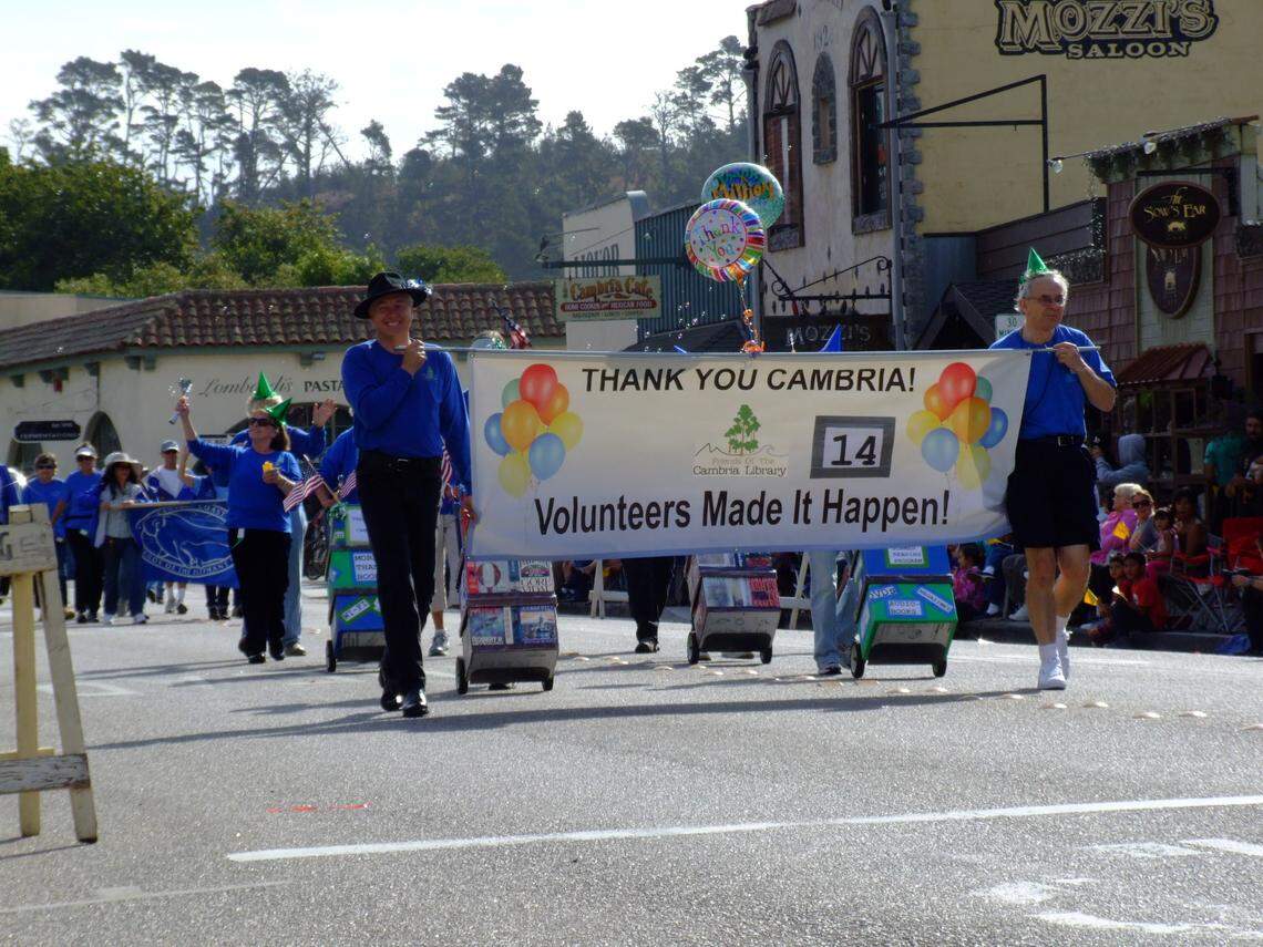 Dedicated Friends of the Cambria Library volunteers thank donors via their 2013 entry in the Pinedorado parade. The Friends group raised half of the more than $4 million needed to buy and retrofit the town’s newest library building.