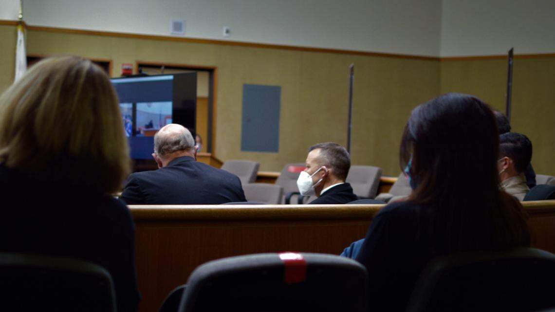 Paul Flores, center, listens in court on Friday, Jan. 21, 2022, for a hearing in which Judge Jacquelyn Duffy denied his request to dismiss the murder case against him. Flores is accused of killing Cal Poly student Kristin Smart.