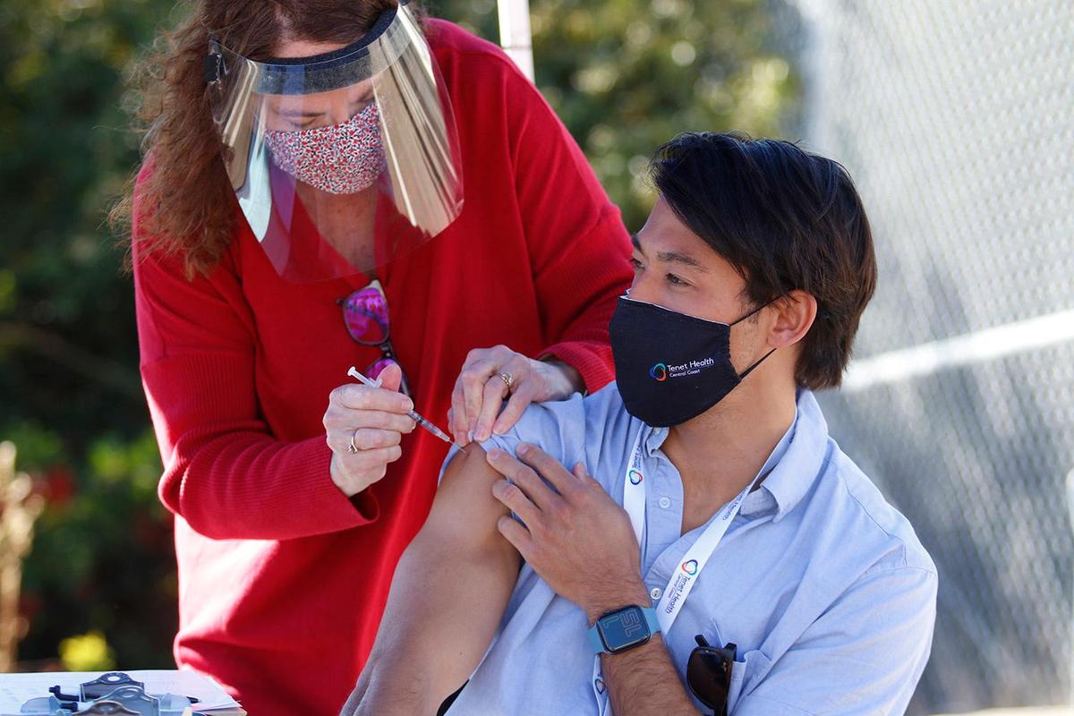 Dr. Matthew Williams, emergency physician at Sierra Vista Hospital receives a COVID-19 vaccination.