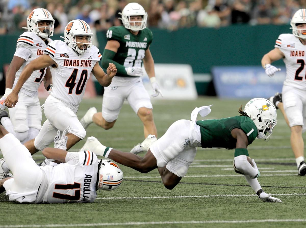 Delano Franklin gets tripped by Damir Abdullah. Cal Poly lost to Idaho State 41-38 in a college football game at Mustang Memorial Stadium on Oct. 5, 2024
