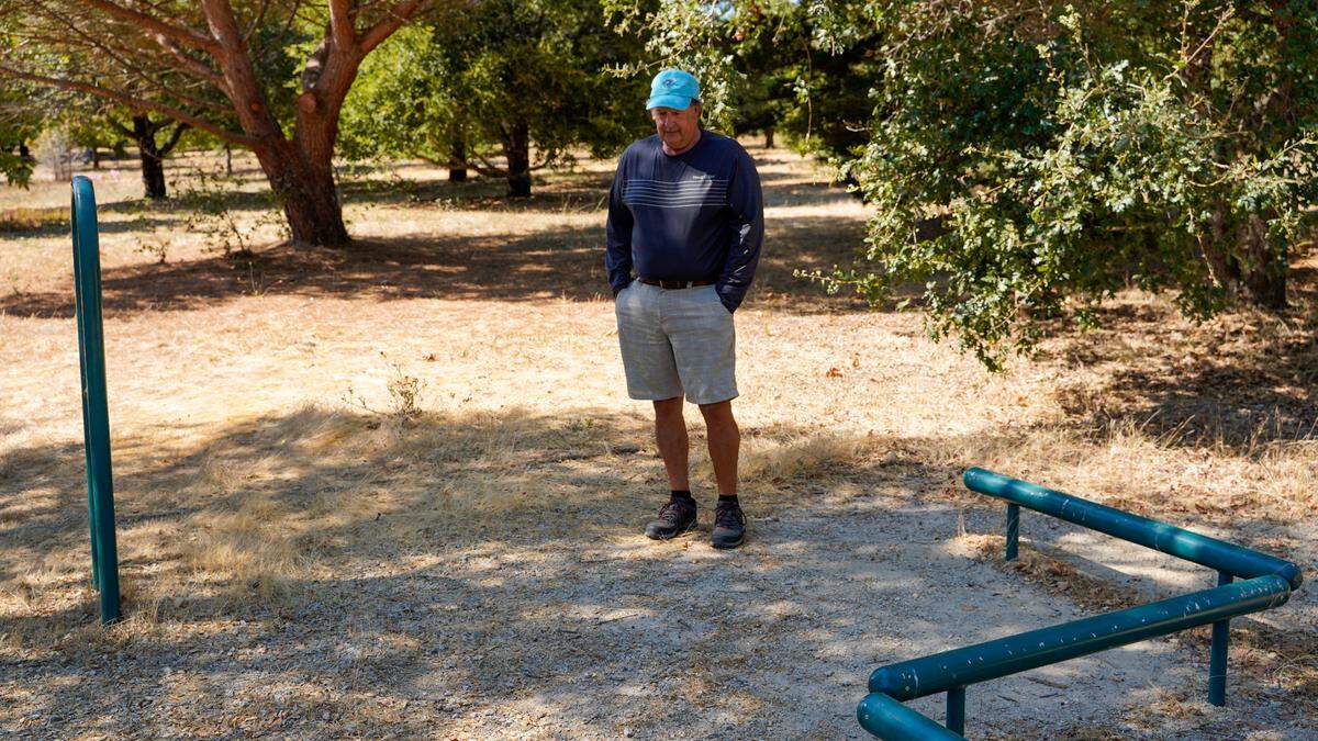 San Luis Obispo resident Brett Cross stands in Laguna Lake Park at the spot where he found 63-year-old homeless resident Sheryl Glidden the morning of April 30, 2024. Cross, pictured Tuesday, Sept. 24, 2024, was high school classmates with Glidden, who died while homeless.