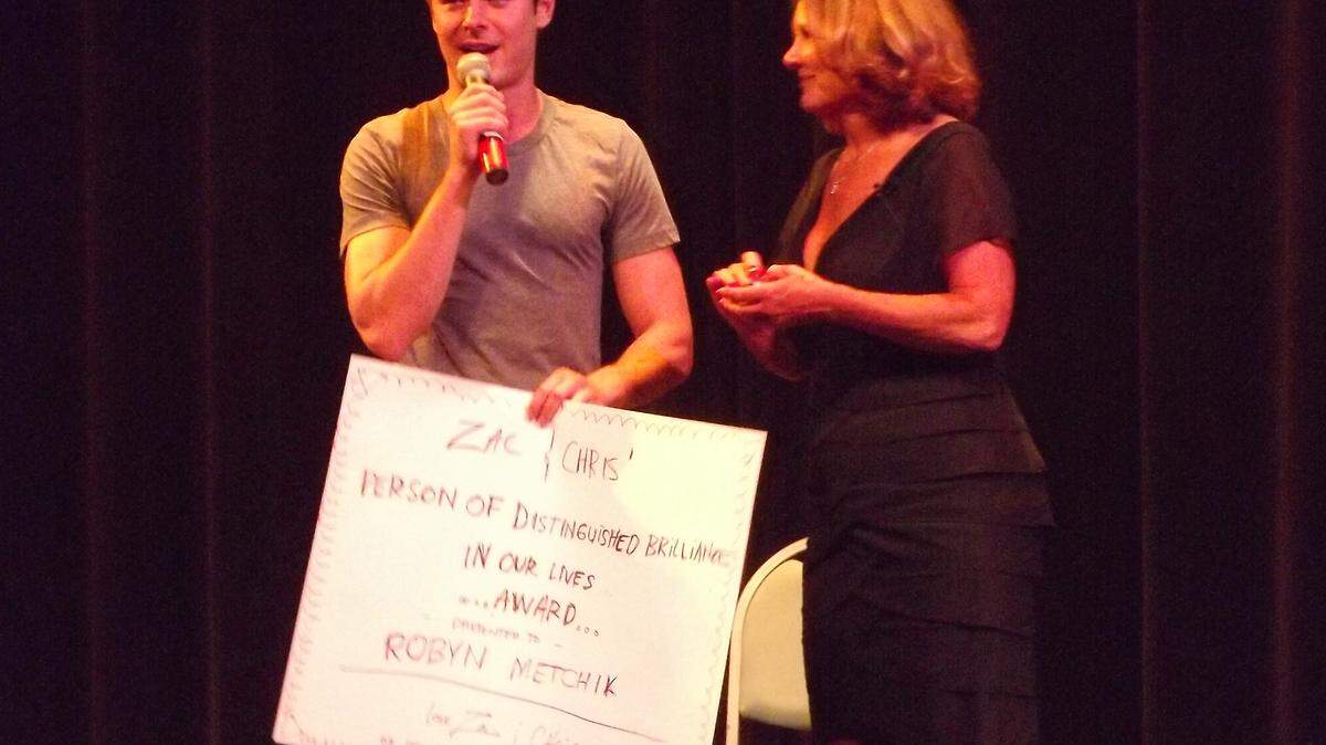 Actor Zac Efron surprises his former drama teacher, Robyn Metchik, at a retirement tribute show at the Clark Center for the Performing Arts on Friday night.