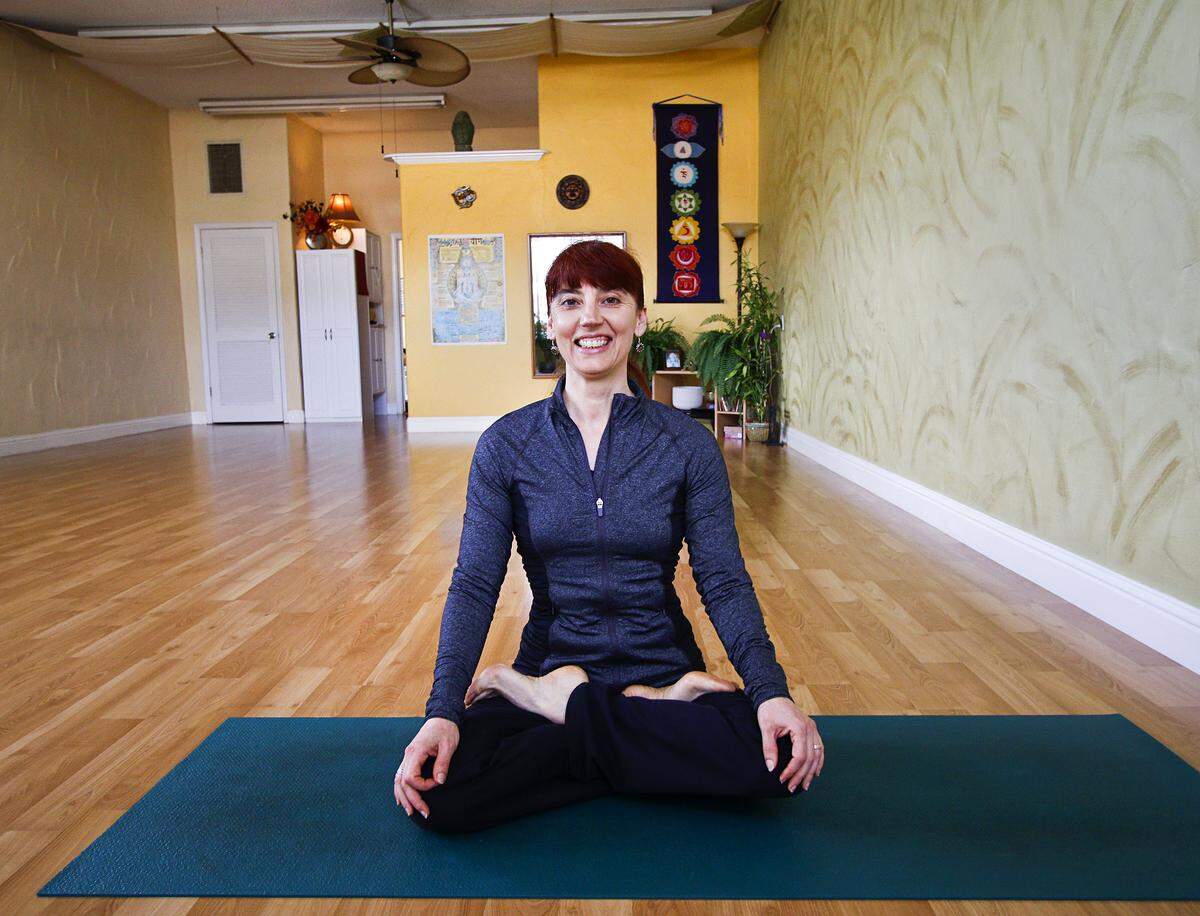 Morro Bay yoga business owner Valentina Petrova is struggling to get funded for a business loan amid a bank backlog of application requests. She is pictured here at her former studio in 2015.
