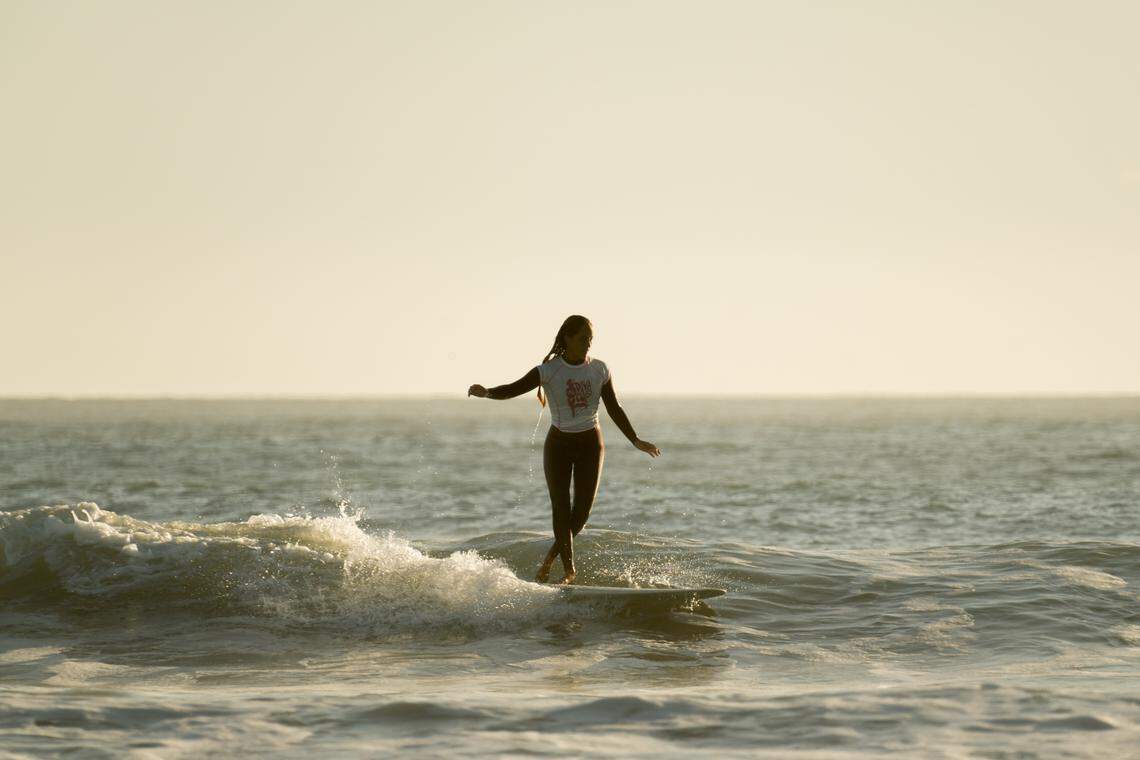 A surfer competes in the third annual Diva Cup Surf Invitational, San Luis Obispo County’s only woman’s surf competition, in Cayucos on Nov. 22, 2025.