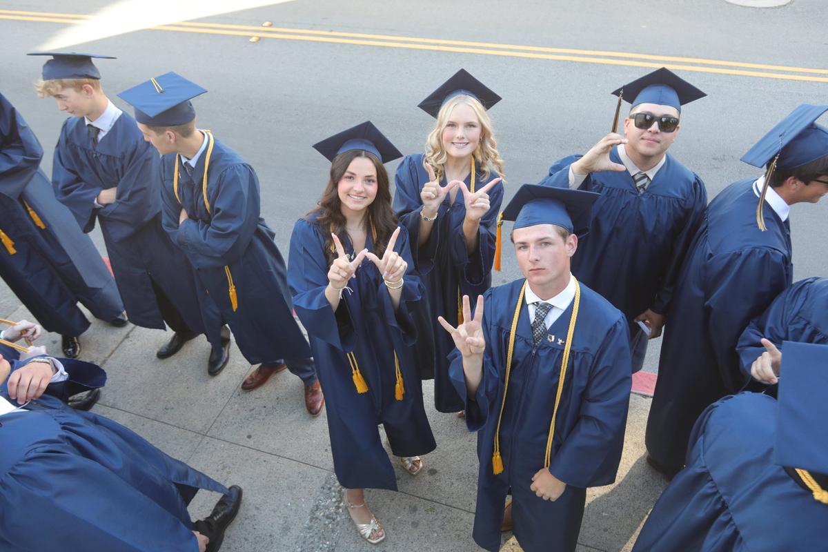 Clockwise from left, Ella Blair, Daniella Swedenborg, Gabriel Rodriguez, Joseph Clipperton all signal their post graduate plans. Mission College Prep awarded diplomas to 69 graduates on the steps of Mission San Luis Obispo on May 31, 2024.