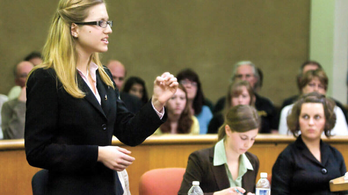 Templeton High School student Sierra Swan, left, acting as a defense attorney pleads her case to Judge Dodie Harmon as San Luis Obispo High school students, Maia Vernacchia, middle, and Emily Tomac listen during the finals of the countywide Mock Trial competition on Thursday in the SLO County Courthouse.  Templeton not only won the case with their client being found not guilty but they also won the Mock Trial.
Photo by Nick Lucero 02-11-10
