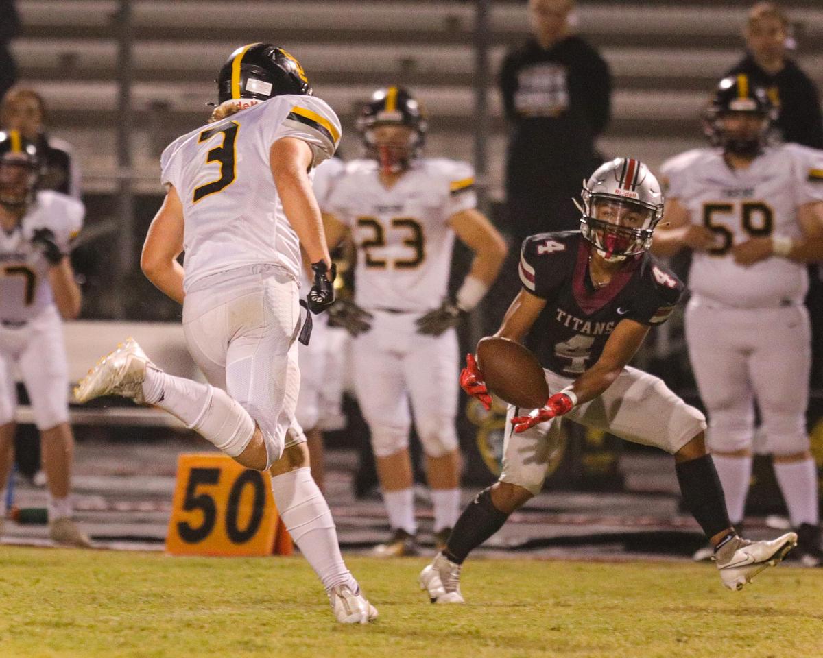 Raemar Agnes intercepts a pass that he then returned for a Titan touchdown. Nipomo beat San Luis Obispo 27-10 on Sept. 24, 2021.