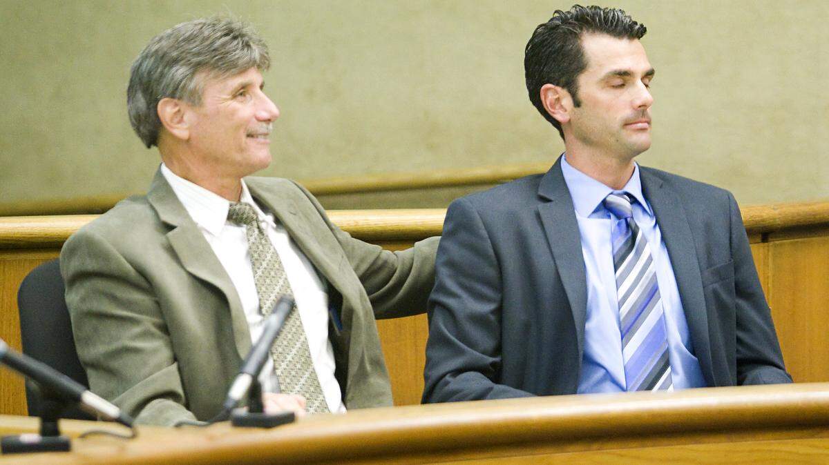 John Ryan Mason, right, closes his eyes upon hearing the judge declare a mistrial Thursday, Sept. 27, as the jury deadlocked in Mason’s assault and battery case. At left is Mason’s attorney, Chris Casciola.
