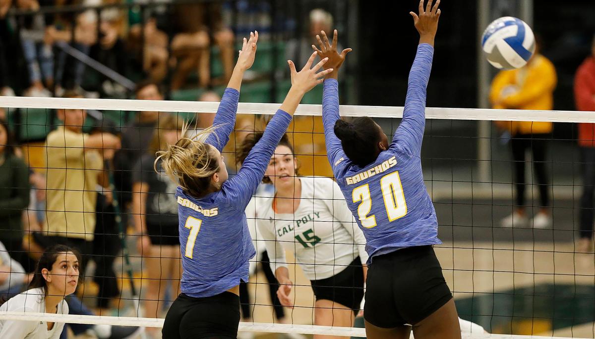Cal Poly women’s volleyball team swept rival UC Santa Barbara at Cal Poly’s Mott Gym in San Luis Obispo on Saturday, Nov. 9, 2019. Cal Poly’s Maia Dvoracek (15) spikes the ball past UCSB’s Gigi Ruddins (7) and) (20) Deni Wilson during the first game.