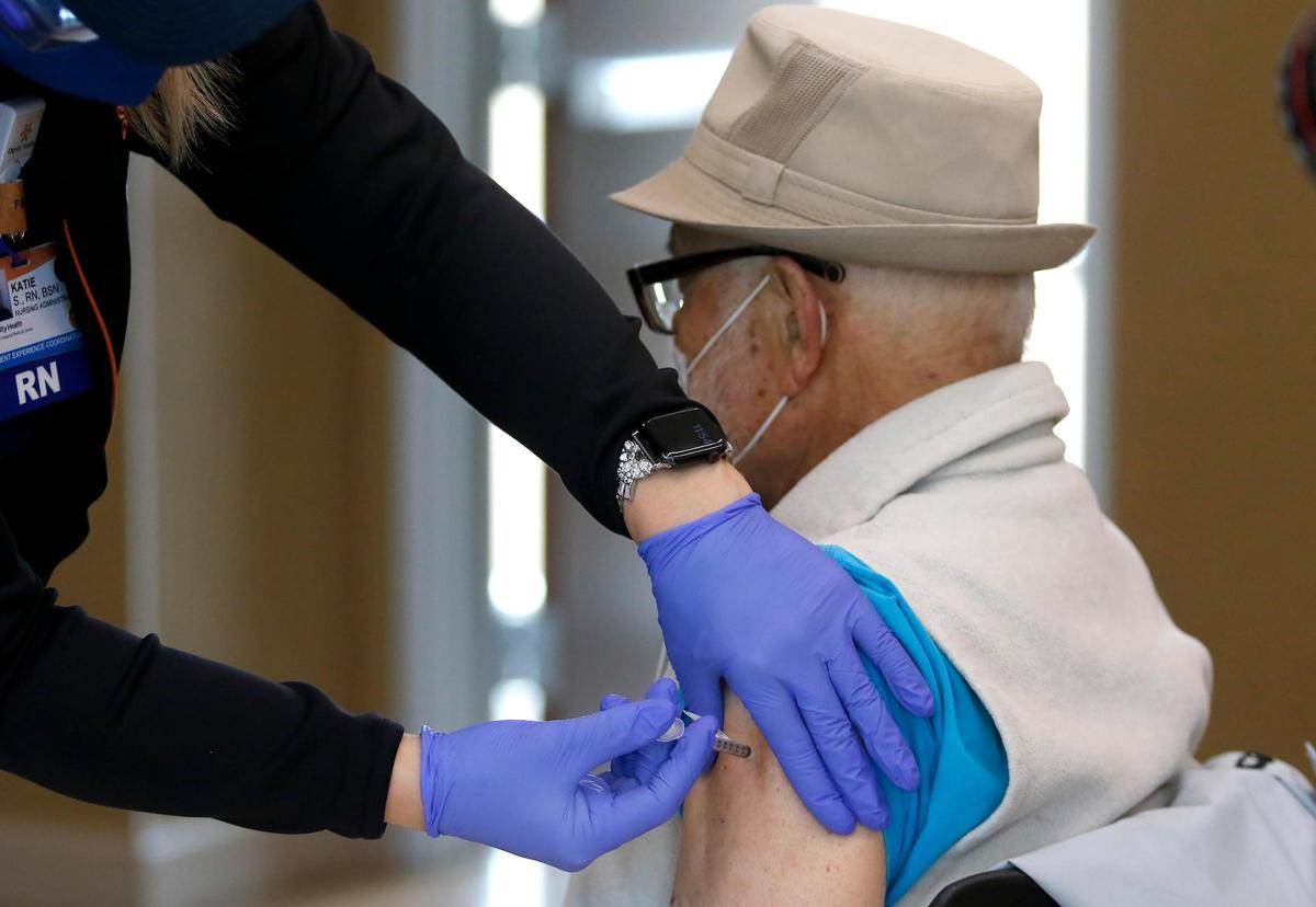 Bob Thomas of San Luis Obispo receives the COVID-19 vaccine at French Hospital Medical Center’s clinic for residents 75 and older in January. People in this age group are now eligible to get Pfizer booster shots at county Public Health clinics.