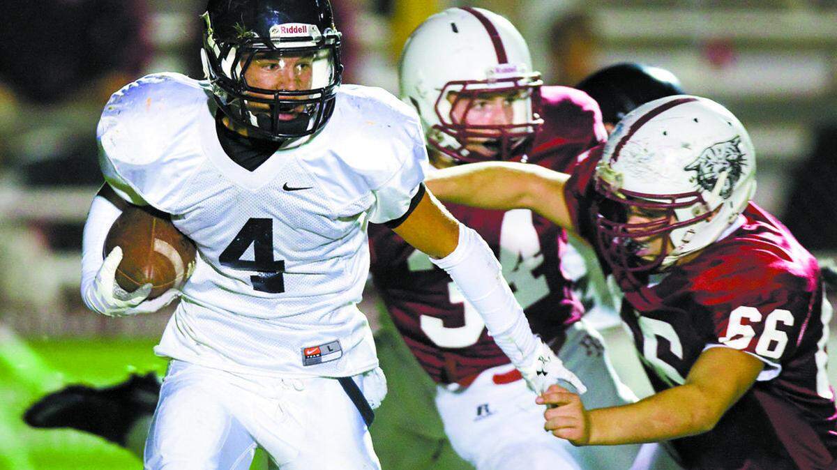 Arroyo Grande’s Michael Jordano, left, tries to get past host Paso Robles’ Luis Alvarado on Nov. 1.