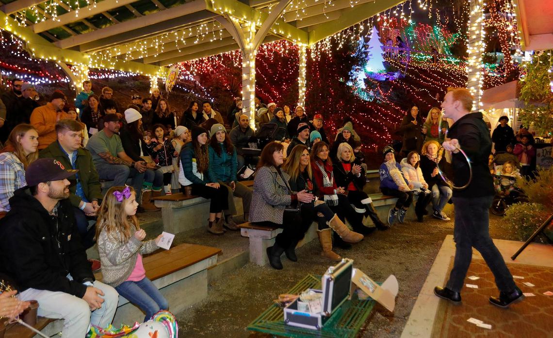 A magician performs for an enthusiastic crowd at the Cambria Christmas Market on Wednesday, Dec. 14, 2022.