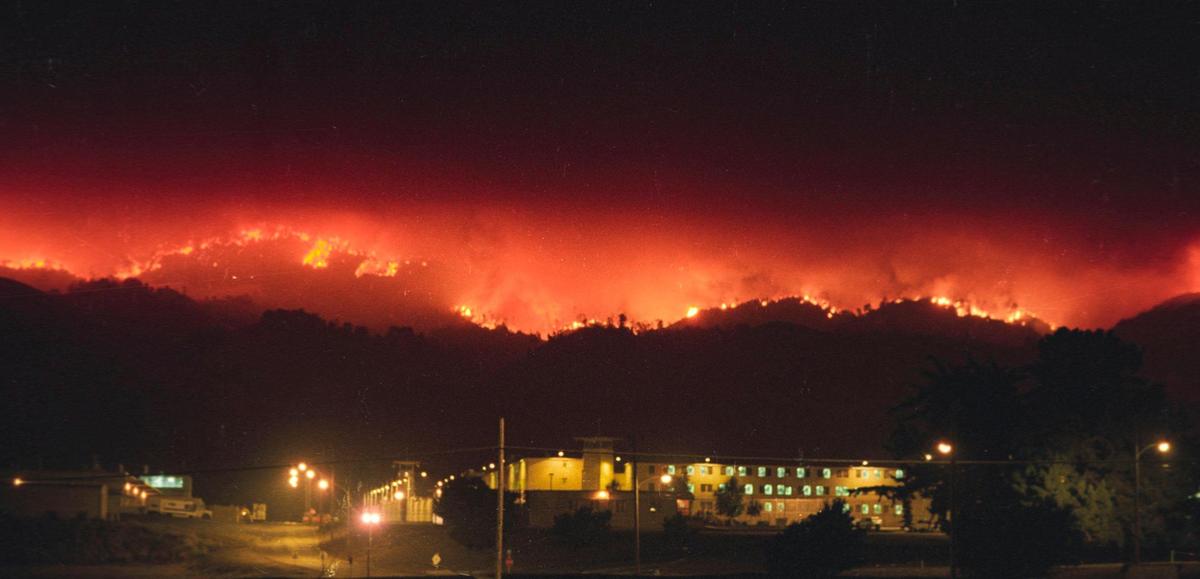 The Highway 41 Fire burns down the Santa Luica Range behind California Men’s Colony on Aug. 15, 1994.