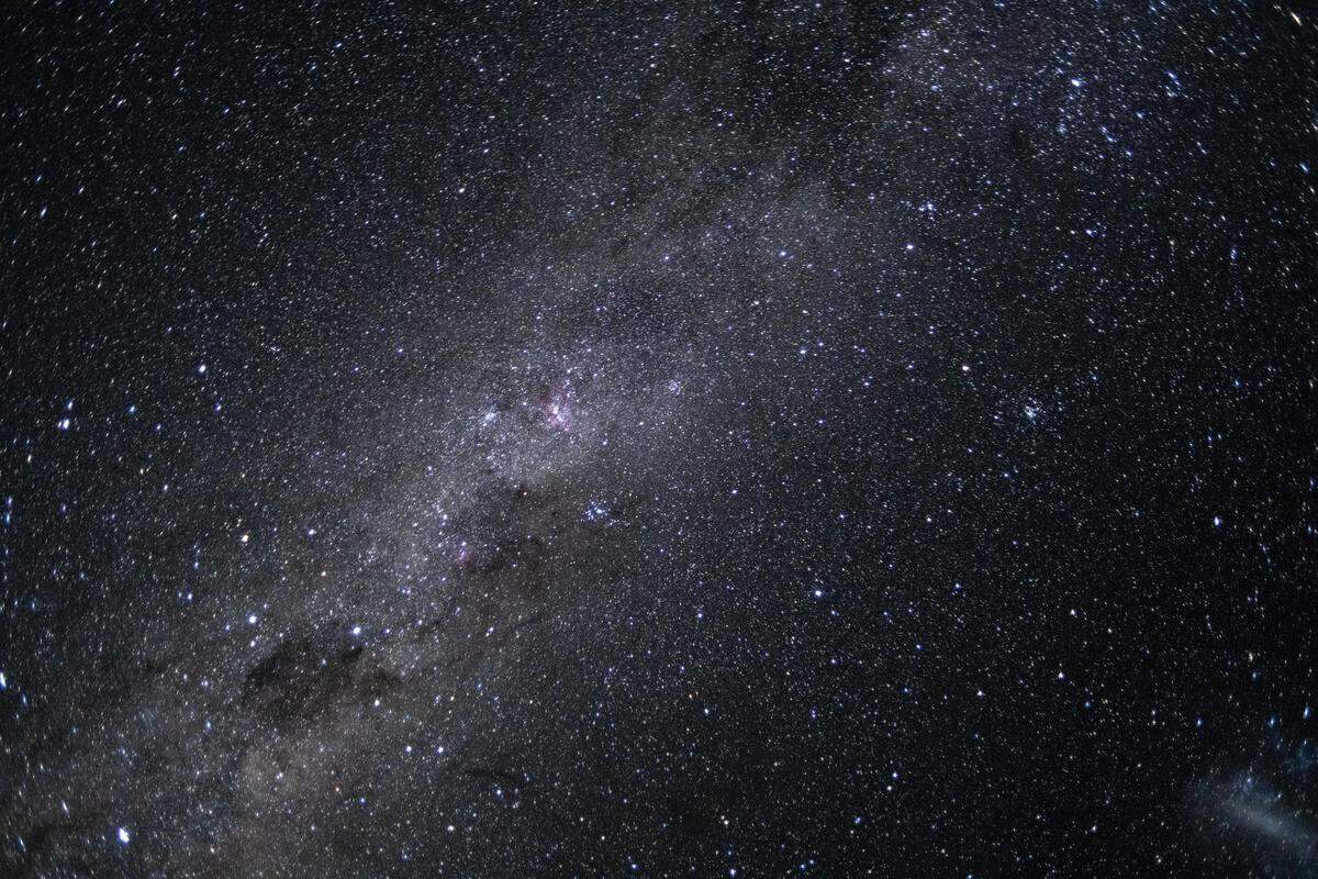 The Artemis II crew captured this photo of our galaxy, the Milky Way, on April 7, 2026. The Milky Way’s elegant spiral structure is dominated by just two arms wrapping off the ends of a central bar of stars. Spanning more than 100,000 light-years, Earth is located along one of the galaxy’s spiral arms, about halfway from the center.