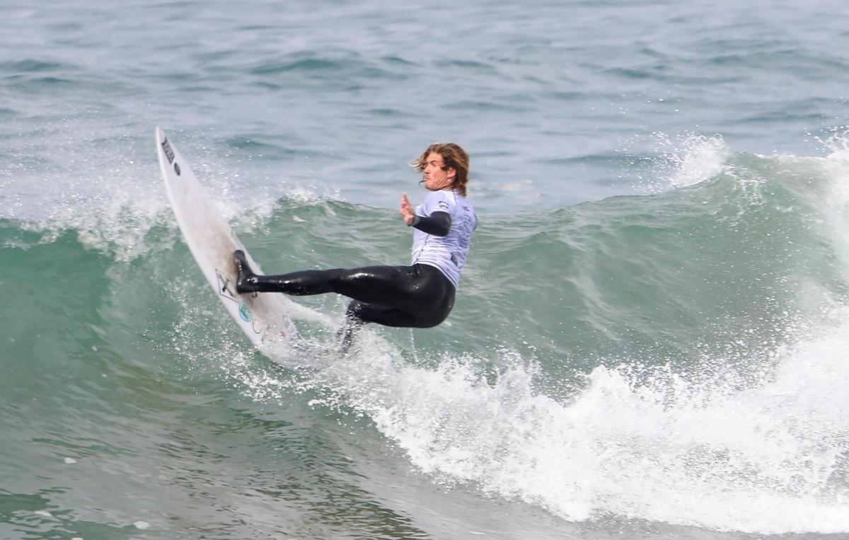 A surfer competes at the SLO CAL Open Qualifying Series at Morro Rock on Saturday, Feb. 26, 2022.