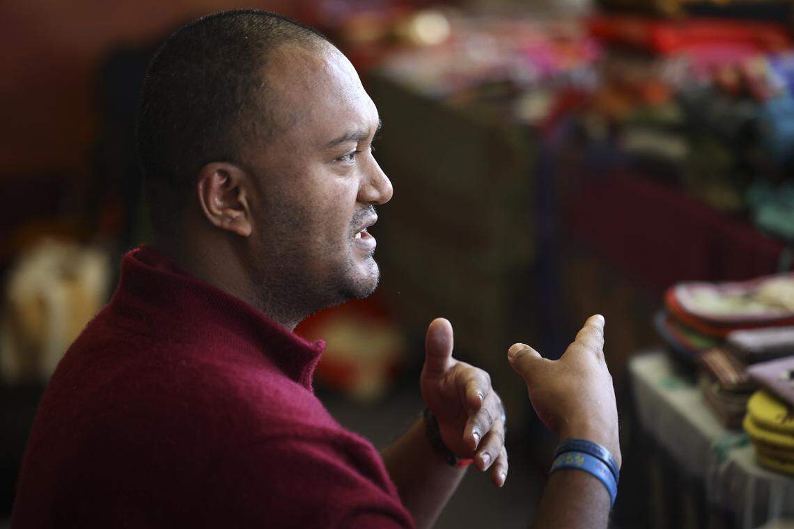 Ven. Lobsang explains the details of of the work the monks were taking part in. Buddhist monks from Tibet were in Atascadero creating a Medicine Buddah Sand Mandala, with the intention to distribute healing energy to all sentient beings and eliminate suffering on Oct. 23, 2025.