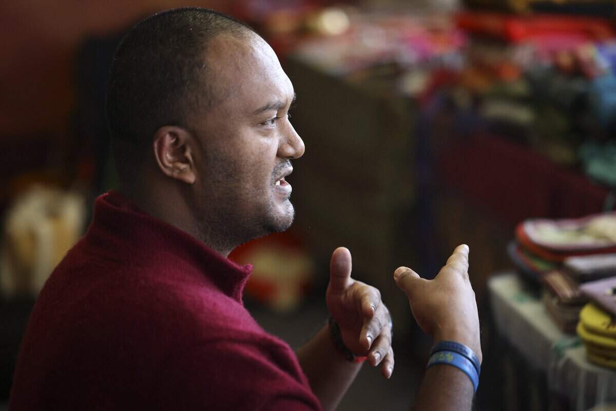 Ven. Lobsang explains the details of of the work the monks were taking part in. Buddhist monks from Tibet were in Atascadero creating a Medicine Buddah Sand Mandala, with the intention to distribute healing energy to all sentient beings and eliminate suffering on Oct. 23, 2025.