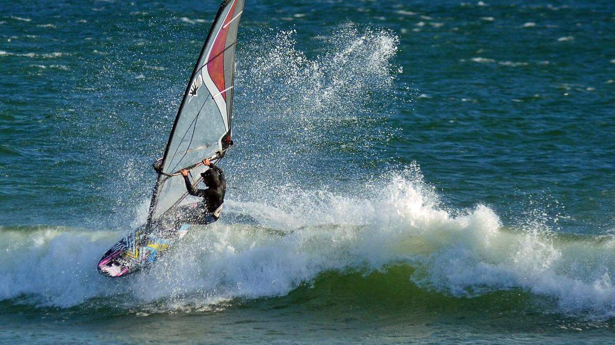 A kite surfer near San Simeon on a sunny and windy day.