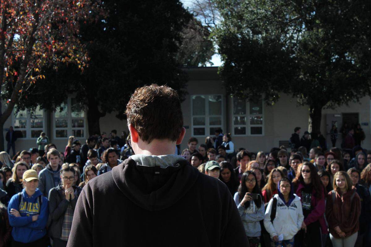 Arroyo Grande High School senior Casey Crouch speaks before the assembled crowd of students during the student walkout to protest gun violence on March 14, 2018.