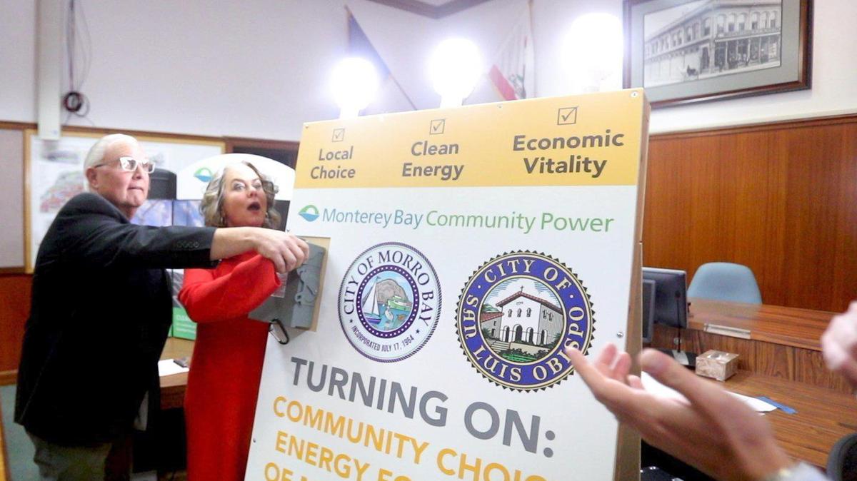 Former mayors John Headding of Morro Bay and Heidi Harmon of San Luis Obispo flip a symbolic switch signaling the start of a new community choice energy program in 2020. San Luis Obispo County, the last holdout, could opt soon opt to join.