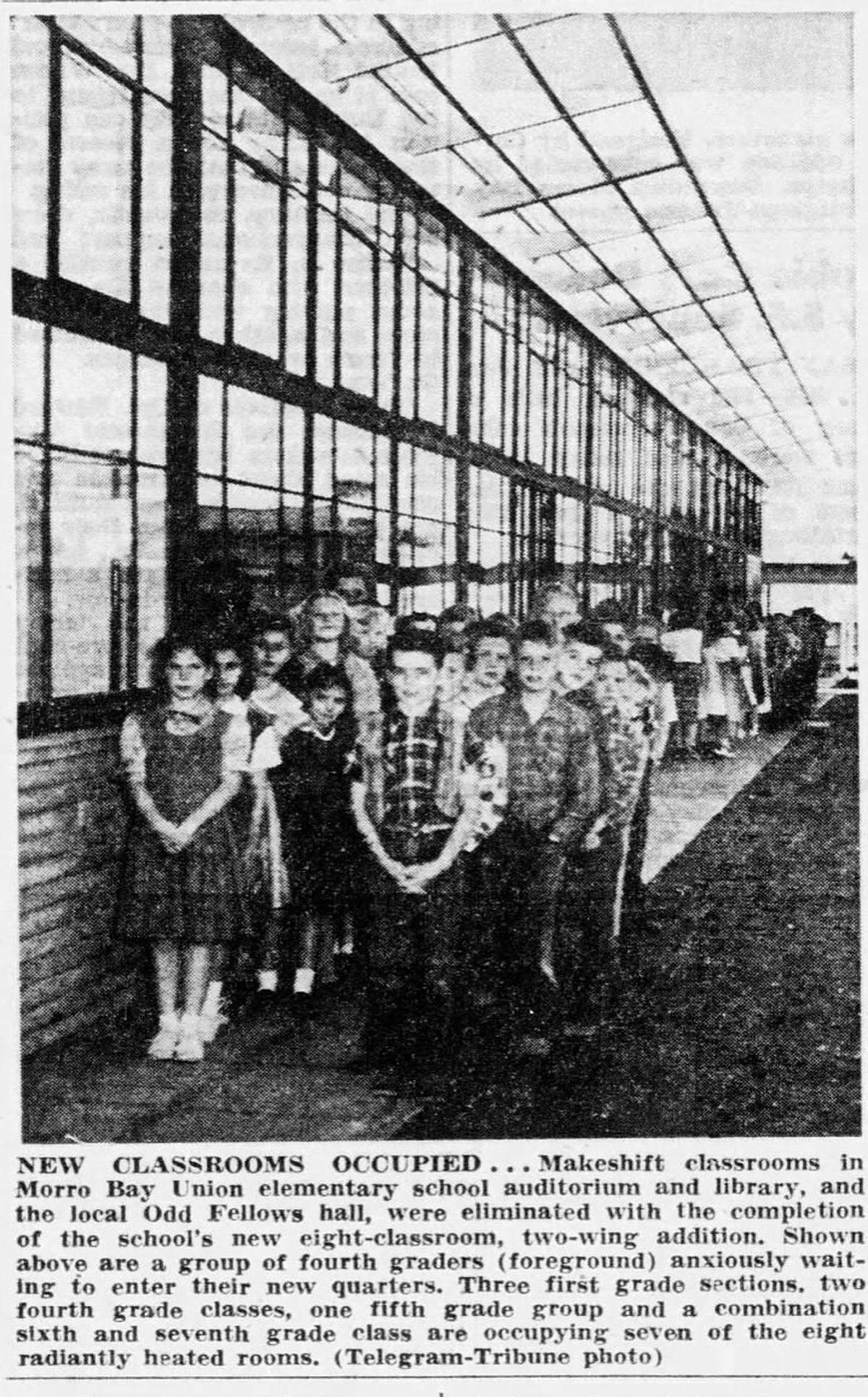 Makeshift classrooms in the Morro Bay Union elementary school auditorium and library, and the local Oddfellows hall, were eliminated with the completion of the school’s eight-classroom, two-wing addition in 1954. Shown above, a group of fourth graders anxiously awaiting to enter their new quarters, three first grade sections, two fourth grade classes, one fifth grade group and a combination of sixth and seventh grade classes are occupying seven of the eight radiently heated rooms. The construction of the new Morro Bay Power Plant was one of the drivers of population growth in town.