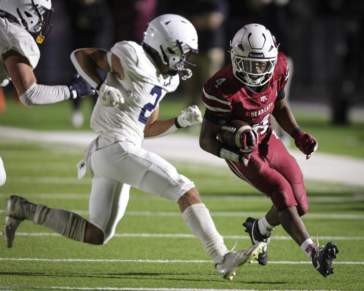 Kassim Williams runs pursued by Levi Childers. Arroyo Grande beat Paso Robles 56-14 on Oct. 3, 2025.