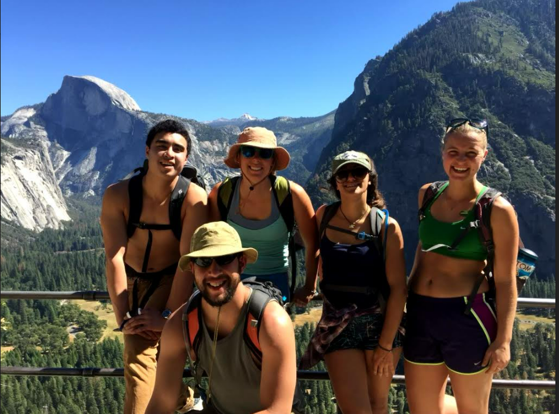 An undated photo shows Edward “Eddie” Giron, kneeling front, during a trip to Yosemite with friends, including Nasim Delavari, center right.