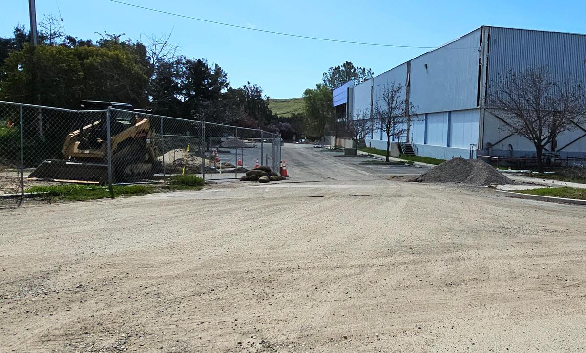 A rutted gravel road leads to Bang the Drum Brewery as seen from Laurel Lane. The tenants at 1150 Laurel Lane in San Luis Obispo were told in March 2025 that they have to vacate the property due to unsafe construction conditions. This includes the popular Bang the Drum brewery and SLO City Church, both of which moved into the partially completed building during the COVID pandemic.