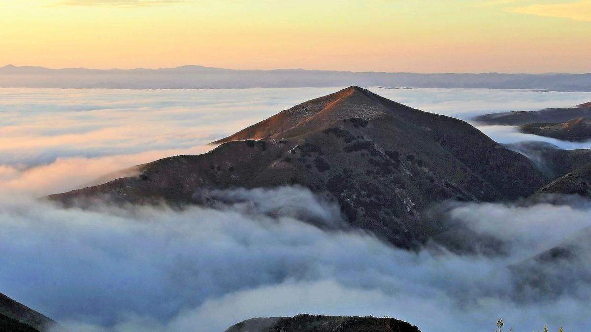Marine layer hanging over the mountains.