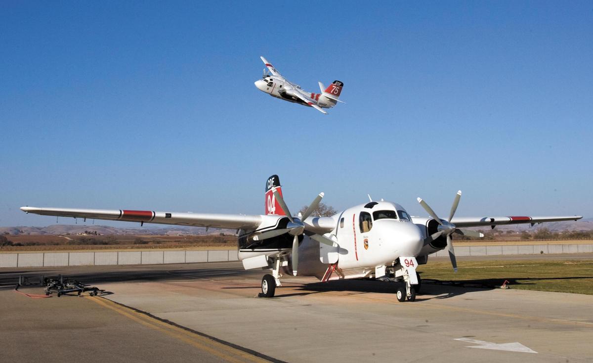 Pilot Robert Pixton returns to Paso Robles Airport after a training mission in an S-2T tanker. Pilots are required to fly at regular intervals to maintain proficiency.