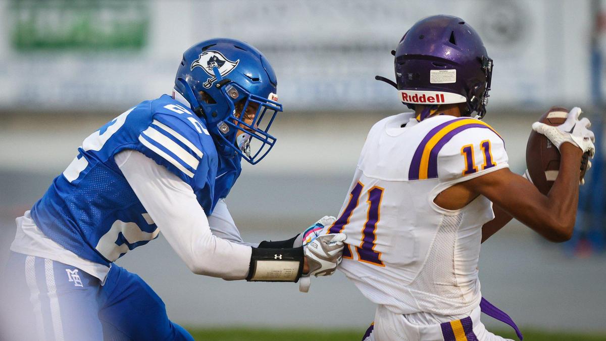 Adin Blackwood of Morro Bay makes a jersey tackle of Fresno’s Delbert Hall in a game the Pirates led 28-13 over Fresno before it was canceled due to lightning on Sept. 9, 2022.