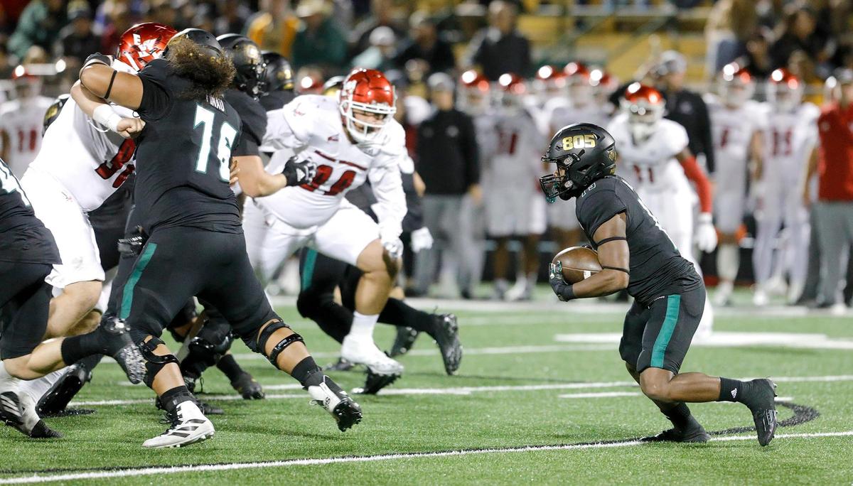 Zion Hall (19) carries the ball for the Mustangs. Cal Poly lost to Eastern Washington 17-10 in a Big Sky Conference football game at Alex G. Spanos Stadium in San Luis Obispo, Saturday, Oct. 22, 2022.